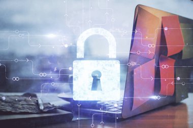 Bilgisayar ve ikon hologramı ile masaüstüne çift pozlama. Veri güvenliği kavramı.