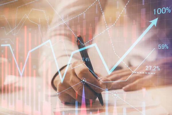 Financial trading graph multi exposure with man desktop background.