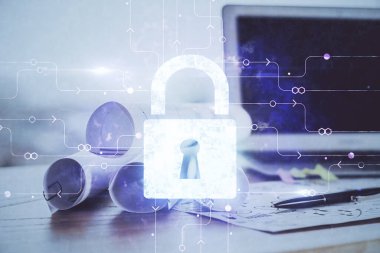 Bilgisayar ve ikon hologramı ile masaüstüne çift pozlama. Veri güvenliği kavramı.