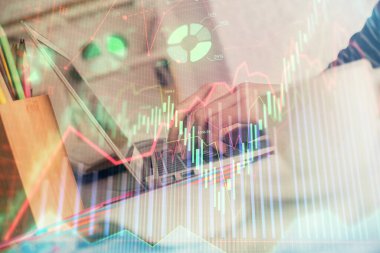 Bilgisayarda ve ön x grafik hologram çiziminde kadın eli yazarken çift pozlama. Borsa yatırım kavramı.