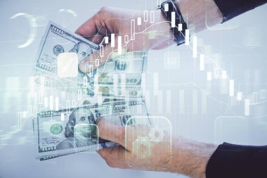 Finansal grafiğe çoklu pozlama hologram, Amerikan dolarları ve insan eli. Analiz kavramı.