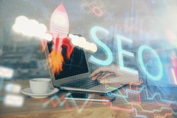 Multi exposure of seo icon with man working on computer on background. Concept of search engine optimization. — Stock Photo, Image