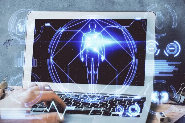 Science hologram with man working on computer on background. Concept of study. Double exposure.
