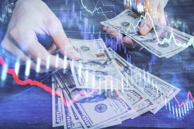 Finansal grafiğe çoklu pozlama hologram, Amerikan dolarları ve insan eli. Analiz kavramı.
