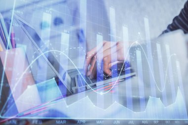 Bilgisayarda ve ön x grafik hologram çiziminde kadın eli yazarken çift pozlama. Borsa yatırım kavramı.