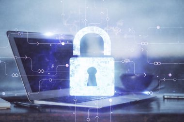 Bilgisayar ve ikon hologramı ile masaüstüne çift pozlama. Veri güvenliği kavramı.