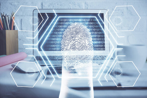 Computer on desktop in office with finger print drawing. Double exposure. Concept of business data security.