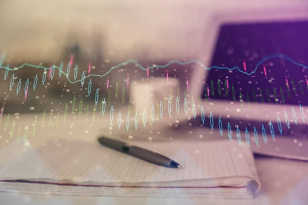 Double exposure of financial graph drawings and desk with open notebook background. Concept of forex market