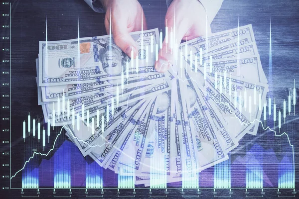 Multi exposure of financial graph drawing hologram and USA dollars bills and man hands. Analysis concept. — Stock Photo, Image