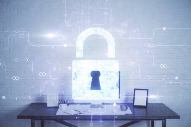 Bilgisayar ve ikon hologramı ile masaüstüne çift pozlama. Veri güvenliği kavramı.