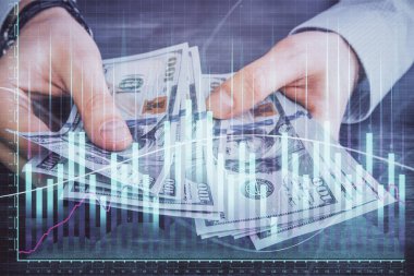 Finansal grafiğe çoklu pozlama hologram, Amerikan dolarları ve insan eli. Analiz kavramı.
