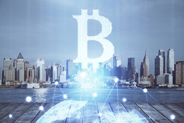 Kripto para birimi temalı hologram çizimi ve şehrin veiw arka planına çift pozlama. Engelleme zinciri ve bitcoin kavramı.