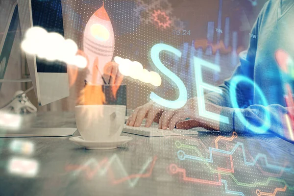 Multi exposure of seo icon with man working on computer on background. Concept of search engine optimization. — Stock Photo, Image