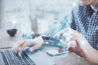 Kredi kartı ve beyin temalı çizimlerle bilgisayarda yazarken çift pozlama. E-ticaret ve yapay zeka kavramı.