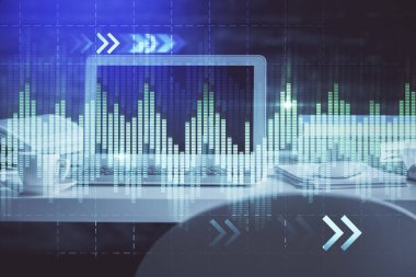 Finansal pazar grafiği hologramı ve kişisel bilgisayar arka planda. Çifte maruziyet. Önx kavramı.