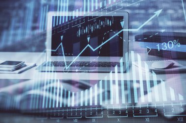 Finansal grafik renkli çizimler ve arka planda bilgisayar olan tablolar. Çifte maruziyet. Uluslararası pazarlar kavramı.