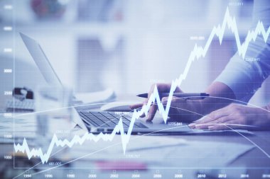 Bilgisayarda ve ön x grafik hologram çiziminde kadın eli yazarken çift pozlama. Borsa yatırım kavramı.