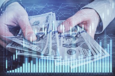 Finansal grafiğe çoklu pozlama hologram, Amerikan dolarları ve insan eli. Analiz kavramı.