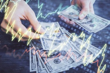Finansal grafiğe çoklu pozlama hologram, Amerikan dolarları ve insan eli. Analiz kavramı.