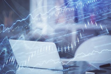 Kişisel bilgisayar arkaplanına çizilmiş borsa hologramı. Çifte maruziyet. Yatırım kavramı.