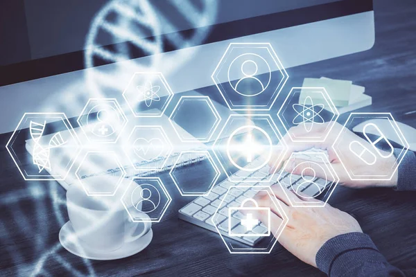 DNA hologram met zakenman werkend op computer op de achtergrond. Concept van bio-engineering. Dubbele blootstelling. — Stockfoto