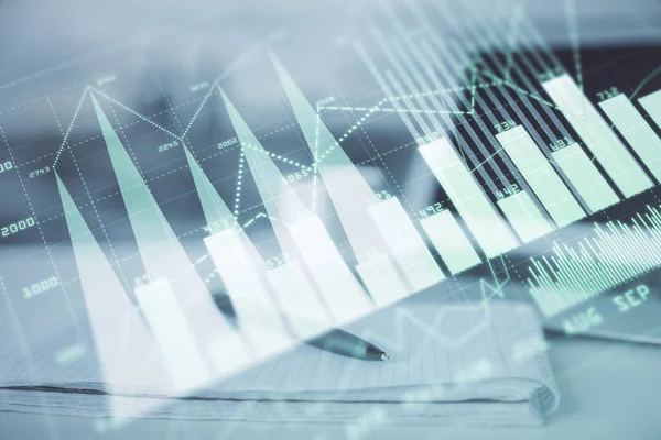 Double exposure of financial graph drawings and desk with open notebook background. Concept of forex market