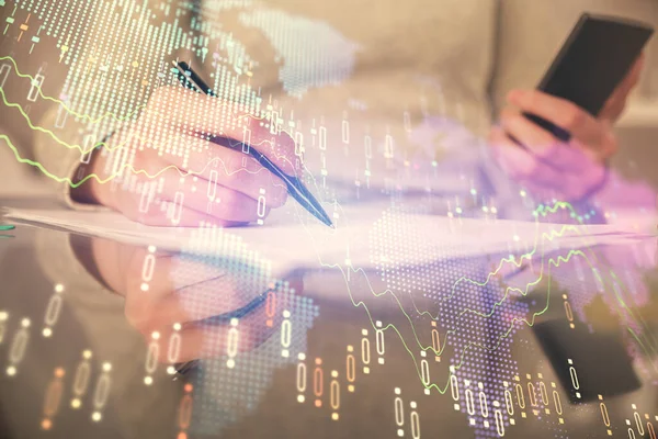 Double exposure of forex chart sketch hologram and woman holding and using a mobile device. Financial market concept.