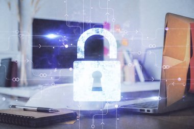 Bilgisayar ve ikon hologramı ile masaüstüne çift pozlama. Veri güvenliği kavramı.