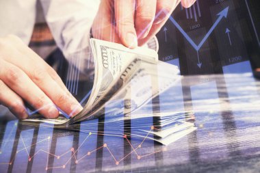 Forx grafiği, hologram, Amerikan dolarları ve insan eli çizimleri. Teknik Analiz kavramı.