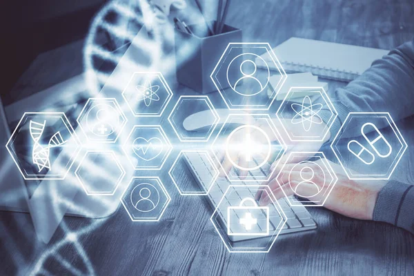 DNA hologram met zakenman werkend op computer op de achtergrond. Concept van bio-engineering. Dubbele blootstelling. — Stockfoto