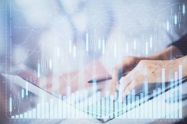 Bilgisayarda ve ön x grafik hologram çiziminde kadın eli yazarken çift pozlama. Borsa yatırım kavramı.