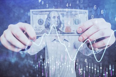 Finansal grafiğe çoklu pozlama hologram, Amerikan dolarları ve insan eli. Analiz kavramı.