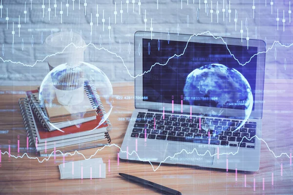 Double exposure of chart and financial info and work space with computer background. Concept of international online trading.