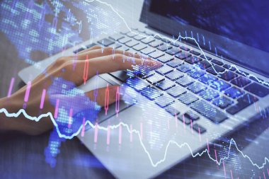 Bilgisayarda ve ön x grafik hologram çiziminde kadın eli yazarken çift pozlama. Borsa analizi kavramı.