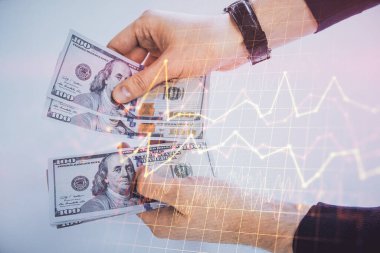 Finansal grafiğe çoklu pozlama hologram, Amerikan dolarları ve insan eli. Analiz kavramı.