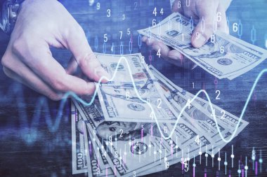 Finansal grafiğe çoklu pozlama hologram, Amerikan dolarları ve insan eli. Analiz kavramı.