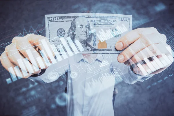 Finansal grafiğe çoklu pozlama hologram, Amerikan dolarları ve insan eli. Analiz kavramı.