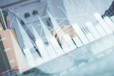 Bilgisayarda ve ön x grafik hologram çiziminde kadın eli yazarken çift pozlama. Borsa yatırım kavramı.