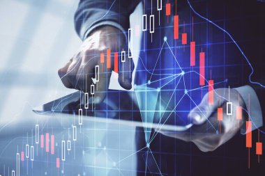 Bir adamın elini tutarken ve dijital bir cihaz ve ön grafik çizimi kullanırken çift pozlama. Finansal piyasa kavramı.