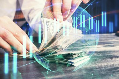 Forx grafiği, hologram, Amerikan dolarları ve insan eli çizimleri. Teknik Analiz kavramı.
