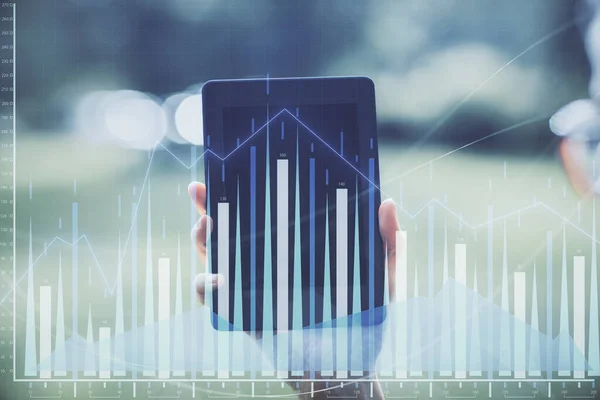 Double exposure of forex chart sketch hologram and woman holding and using a mobile device. Financial market concept.