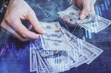 Finansal grafiğe çoklu pozlama hologram, Amerikan dolarları ve insan eli. Analiz kavramı.