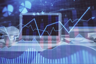 Finansal grafik renkli çizimler ve arka planda bilgisayar olan tablolar. Çifte maruziyet. Uluslararası pazarlar kavramı.