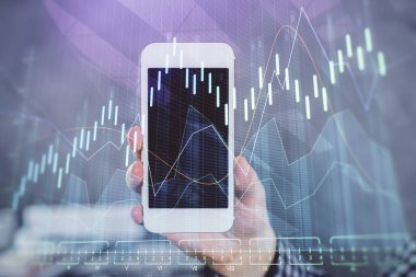Bir adamın elini tutarken ve dijital bir cihaz ve ön grafik çizimi kullanırken çift pozlama. Finansal piyasa kavramı.
