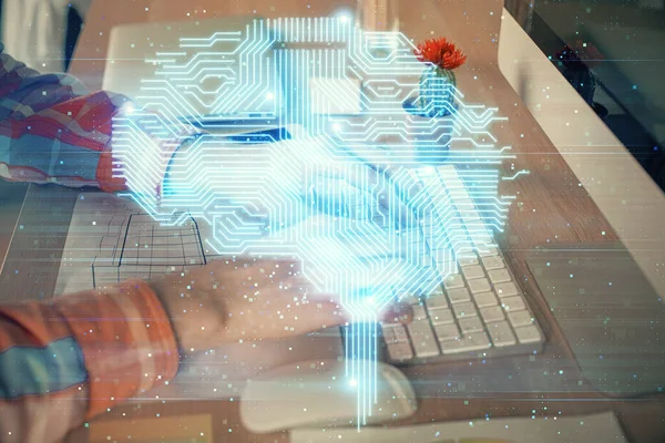 Man typing on keyboard background with brain hologram. Concept of big Data. Double exposure.