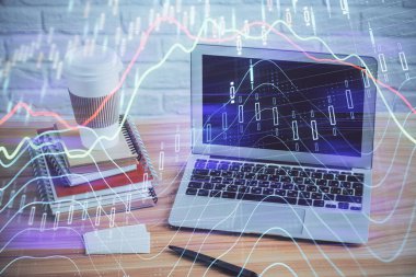 Finansal grafik renkli çizimler ve arka planda bilgisayar olan tablolar. Çifte maruziyet. Uluslararası pazarlar kavramı.