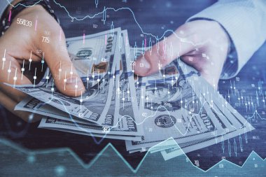 Finansal grafiğe çoklu pozlama hologram, Amerikan dolarları ve insan eli. Analiz kavramı.