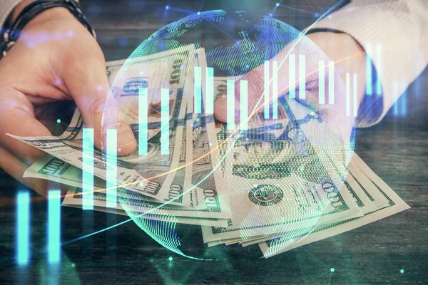 Finansal grafiğe çoklu pozlama hologram, Amerikan dolarları ve insan eli. Analiz kavramı.