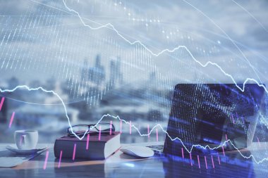 Finansal şema çizimleri ve açık defter arkaplanı olan bir masa. Önx pazarı kavramı