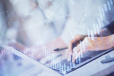 Bilgisayarda ve ön x grafik hologram çiziminde kadın eli yazarken çift pozlama. Borsa yatırım kavramı.